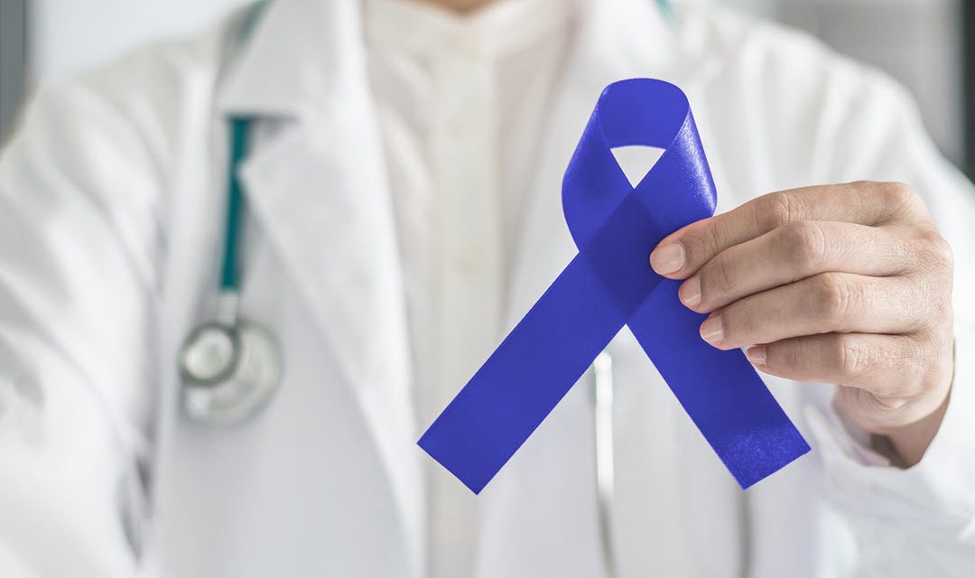 Provider holding blue ribbon