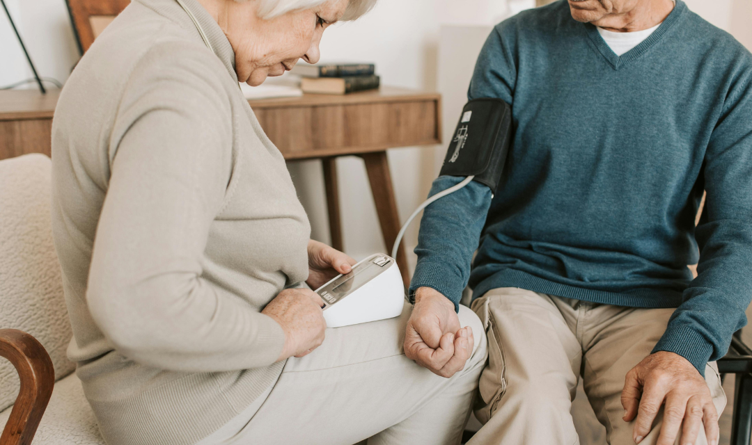Senior woman taking blood pressure